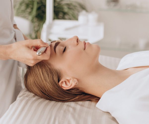 Woman making lifting procedures in a bauty salon Belmed Esthetics